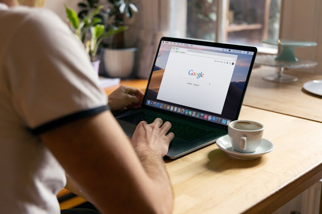 person sending email on laptop