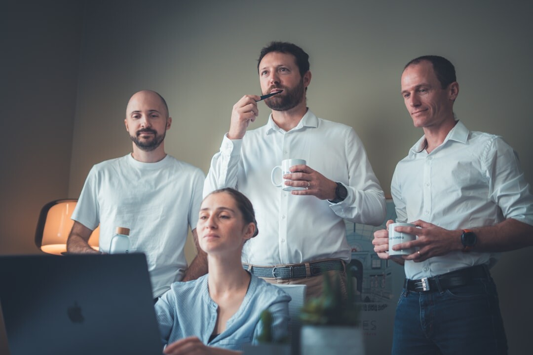 Diverse team of colleagues posing together in an office